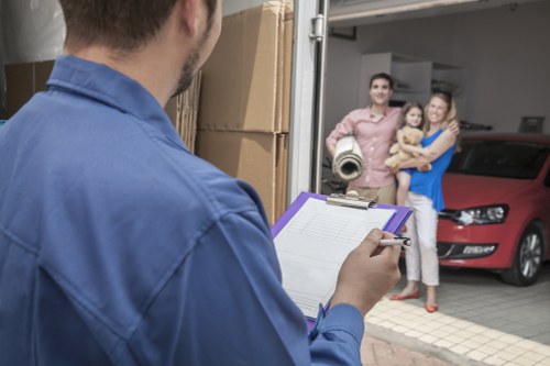 Experts unpacking boxes in a new home